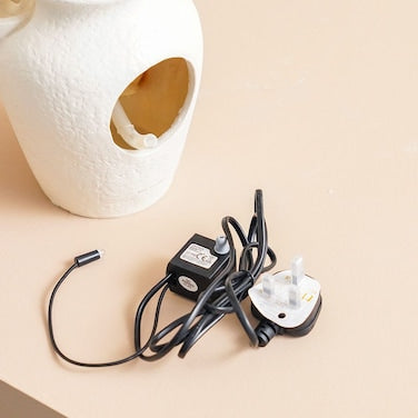 Danube Home Stalaca Modern Indoor Fountain with Soft Yellow Light – Ivory Polyresin Water Feature (33×17×40 cm)